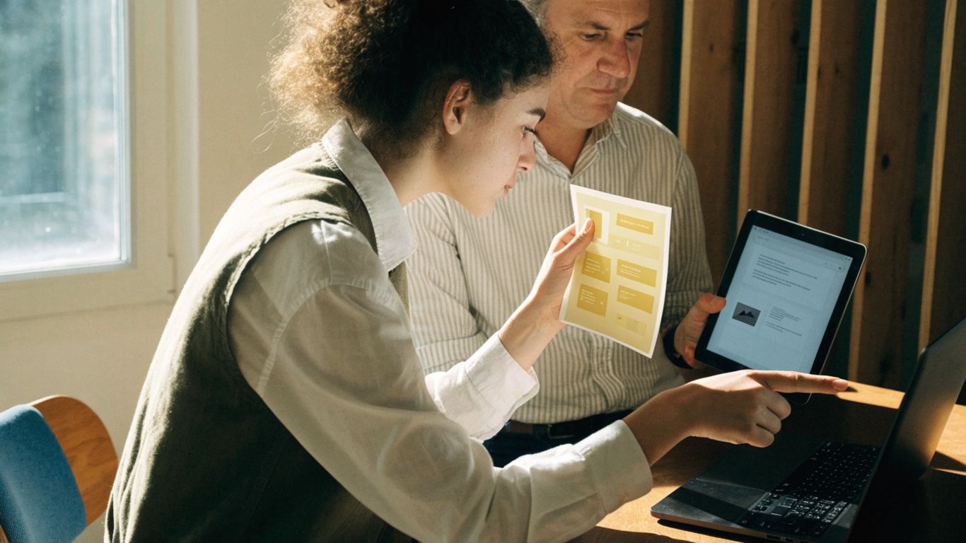 Designer comparing a custom website with a builder interface