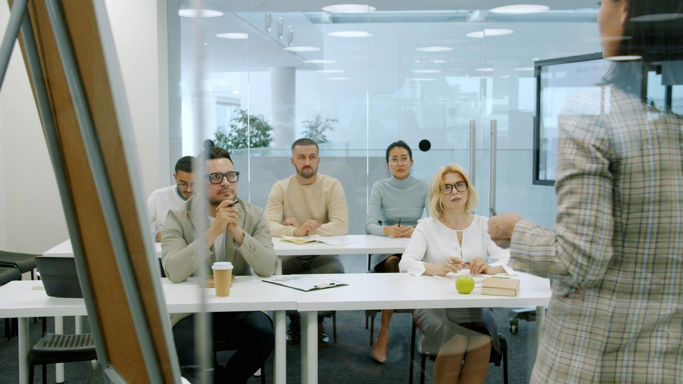 A team of stakeholders discussing AI committee strategies