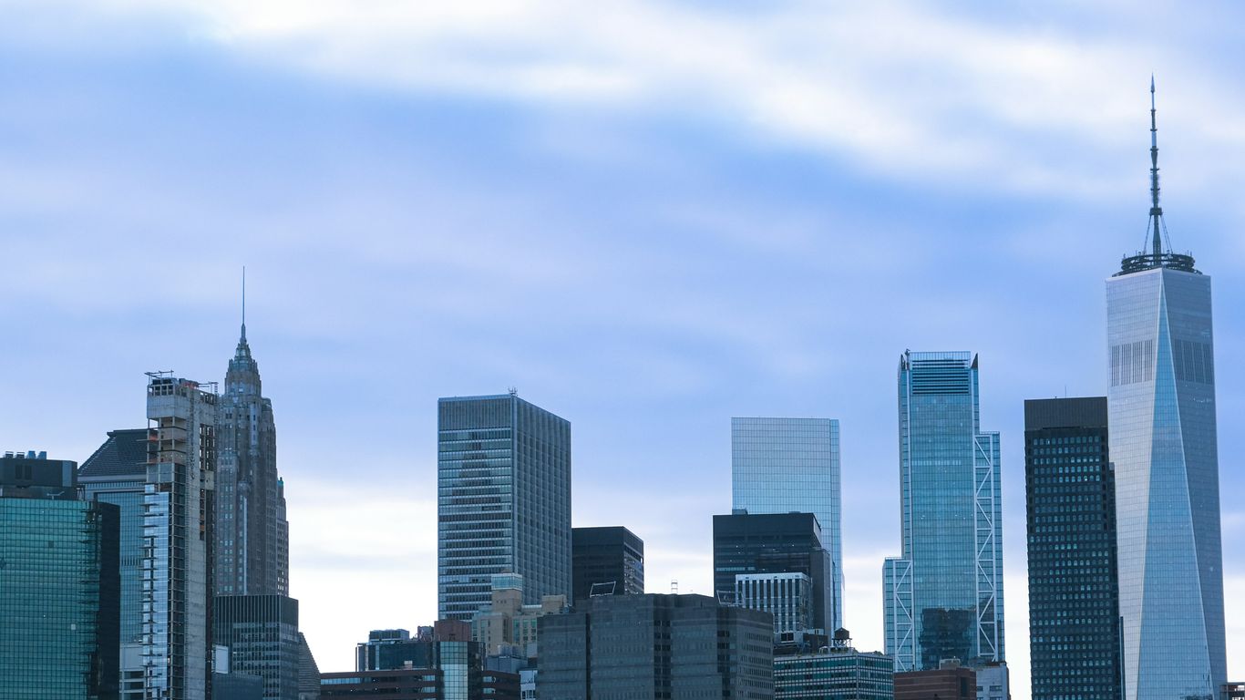 New york city skyline under a cloudy sky.
