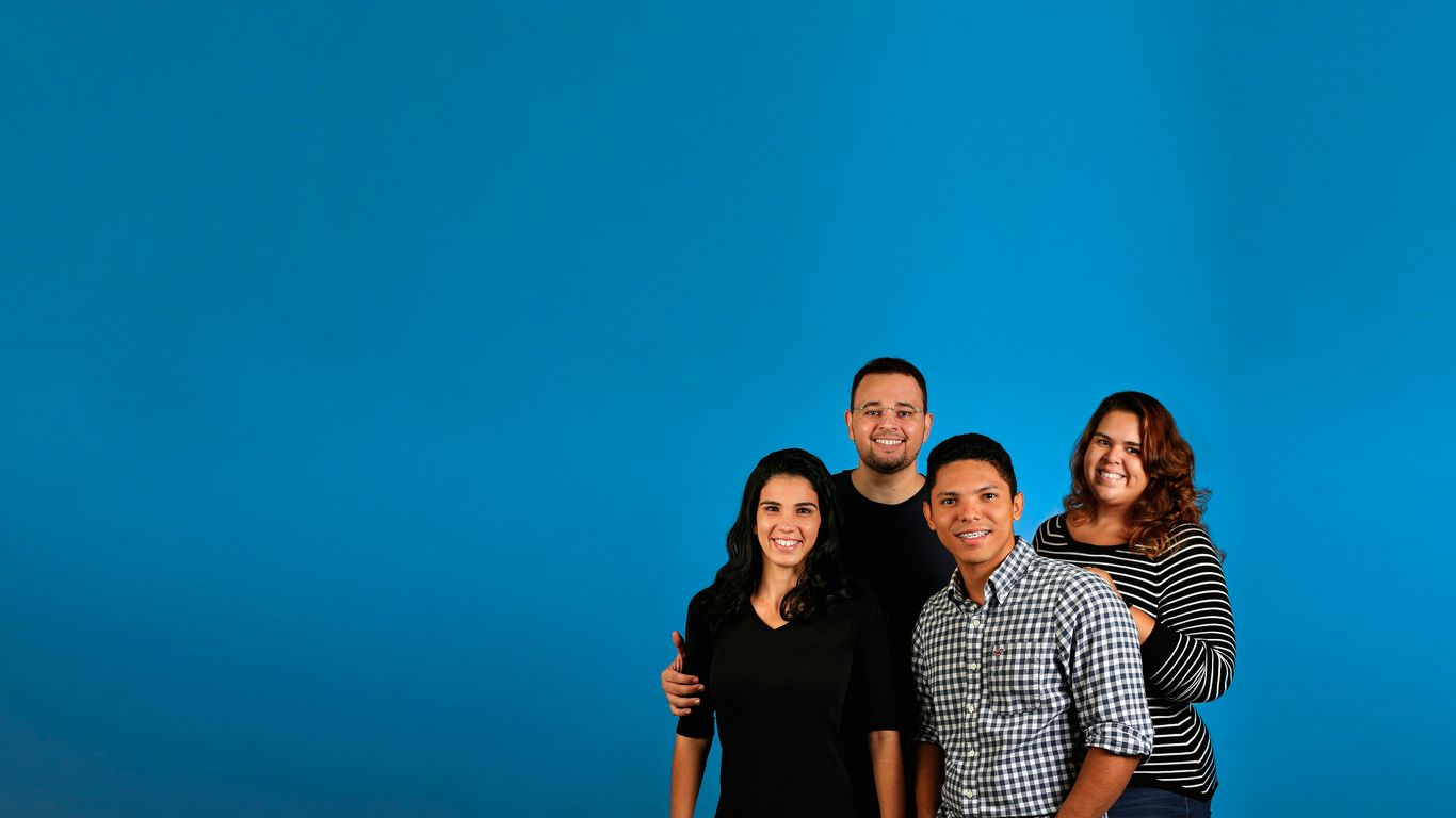 Employees reviewing brand photography ready for high-resolution display