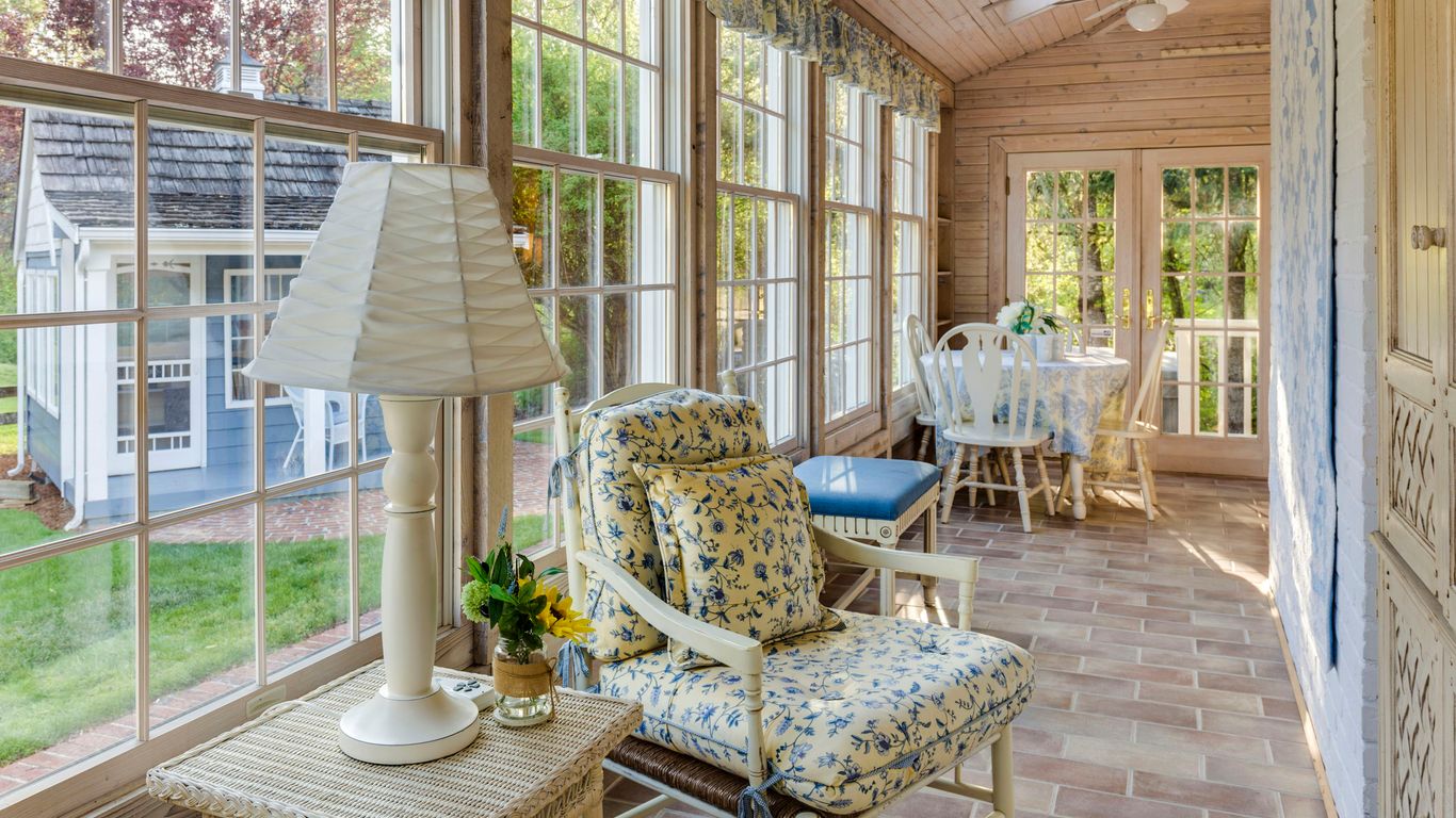 Sunroom featuring light ceramic tiles and bright windows