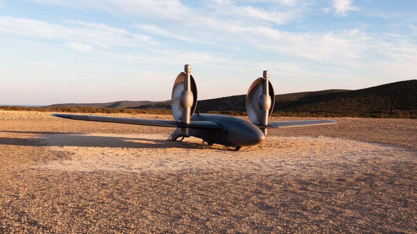 Fixed-wing VTOL aircraft over open terrain