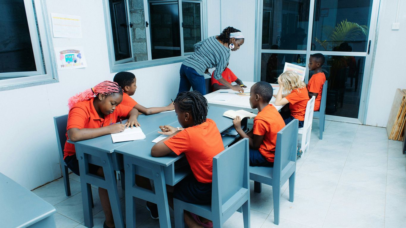 Children playing cooperatively in a classroom
