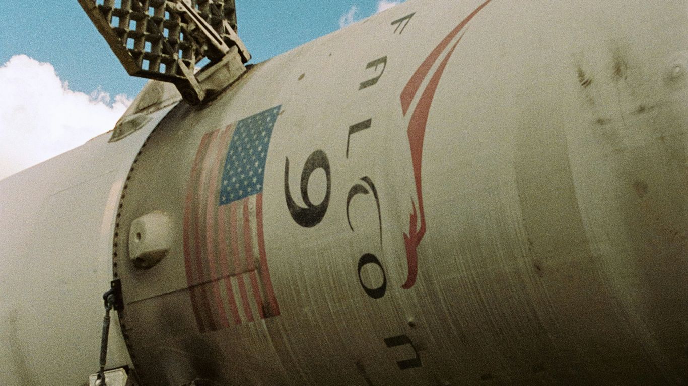 Close-up of a white rocket with american flag