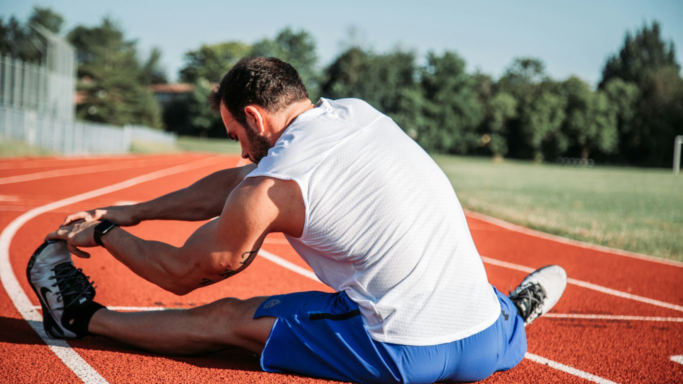 A relaxing reclining stretch with a blue strap