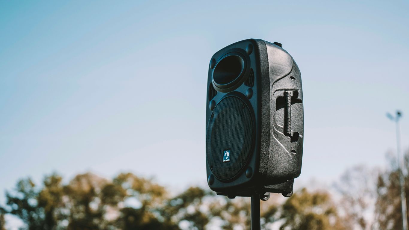 a black and white camera on a pole
