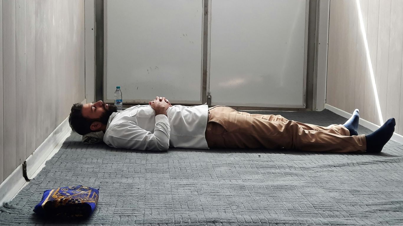 a man laying on the floor in a room