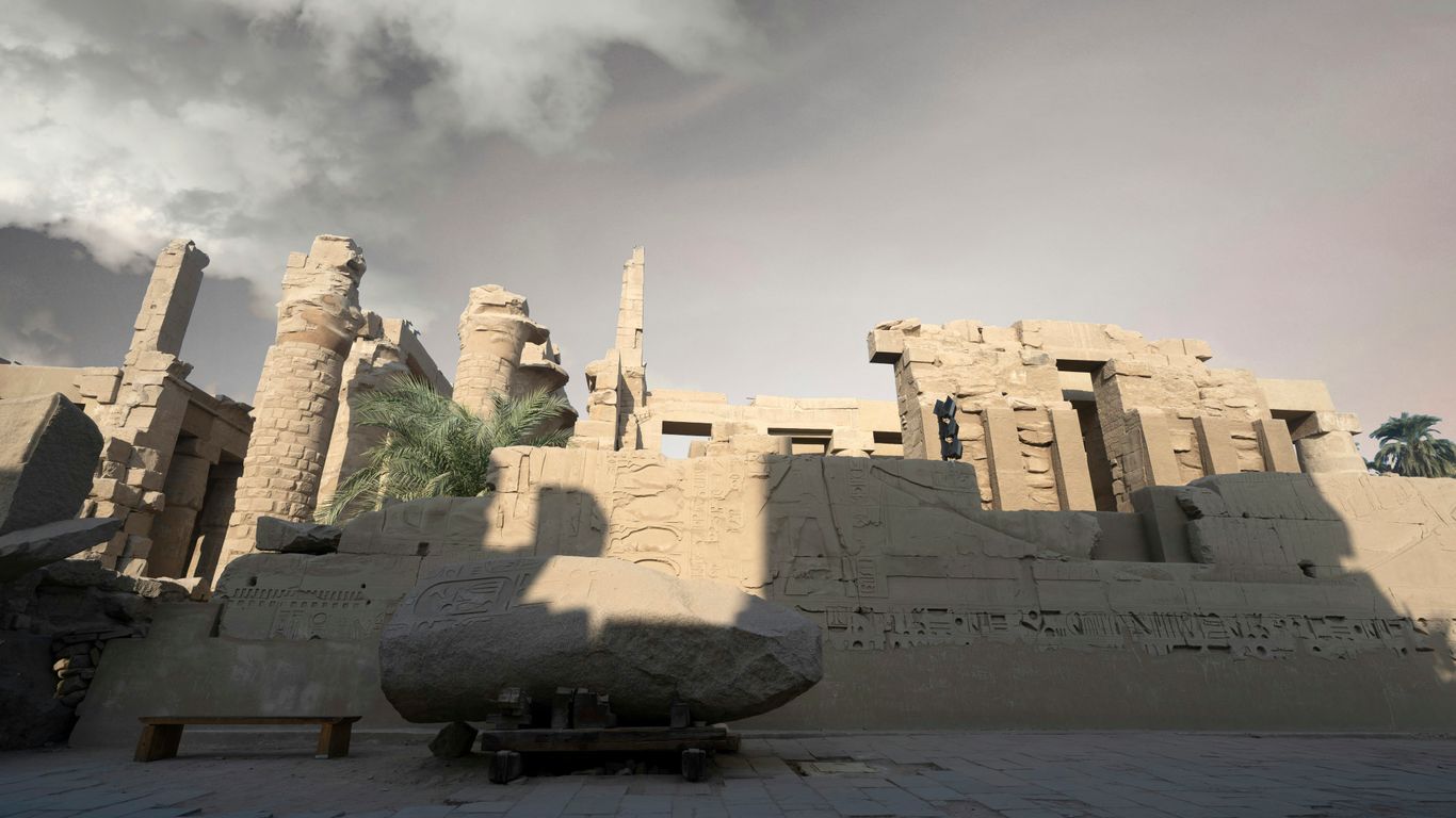 Ancient egyptian temple ruins under a cloudy sky