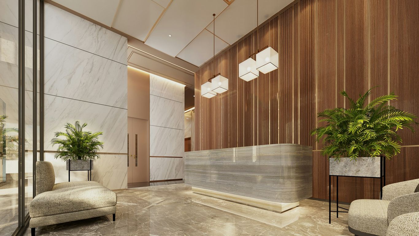 Marble reception desk in refined hotel lobby