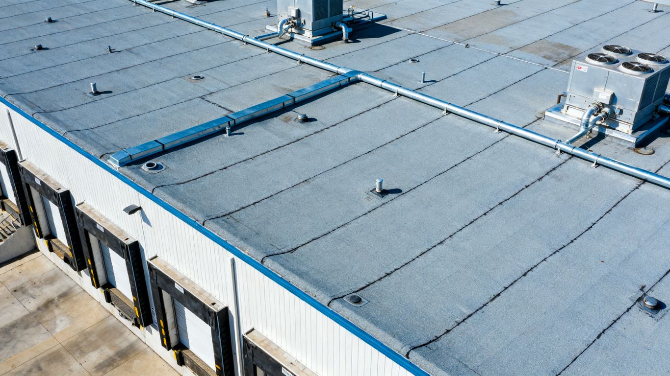 Drone inspecting refrigerated warehouse roof