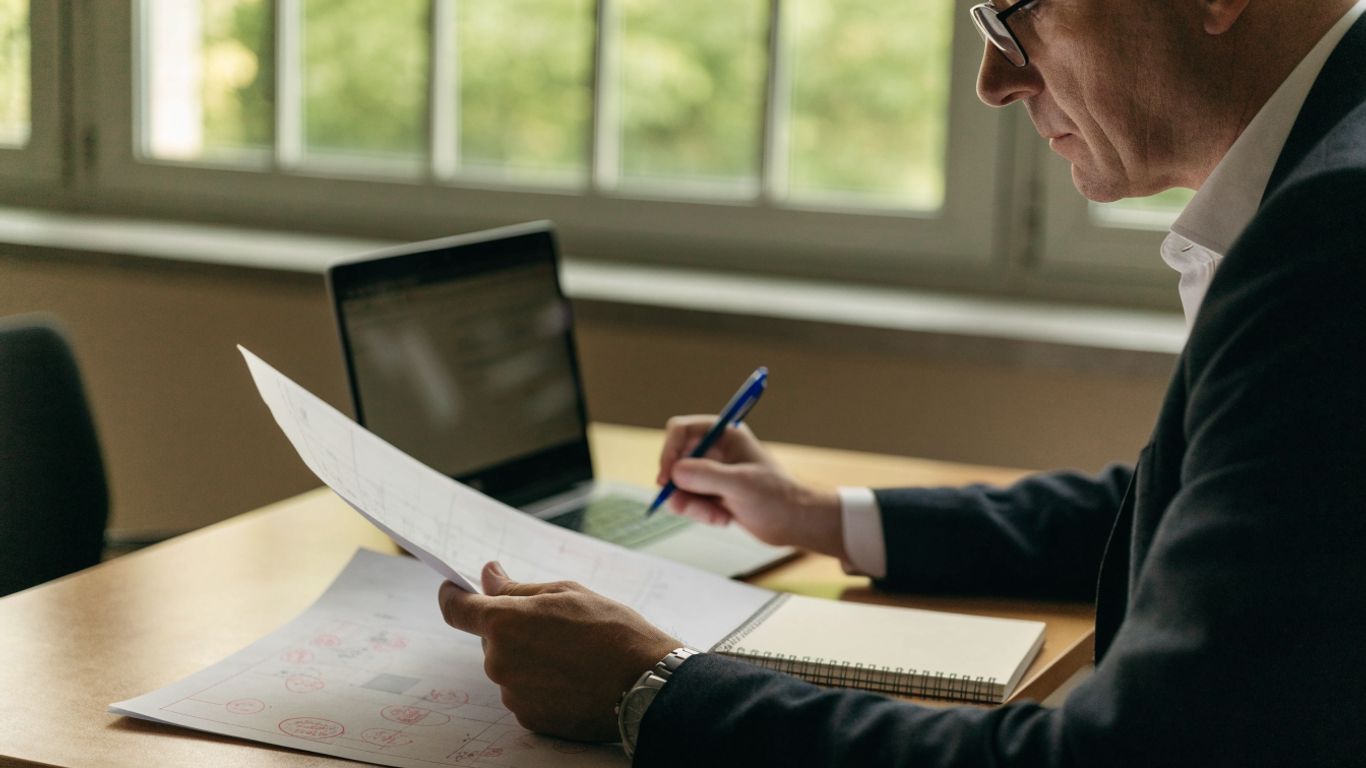 Engineer reviewing professional registration documents