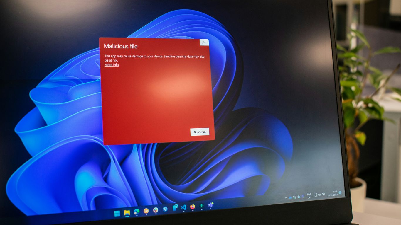 a dell laptop computer with a red screen