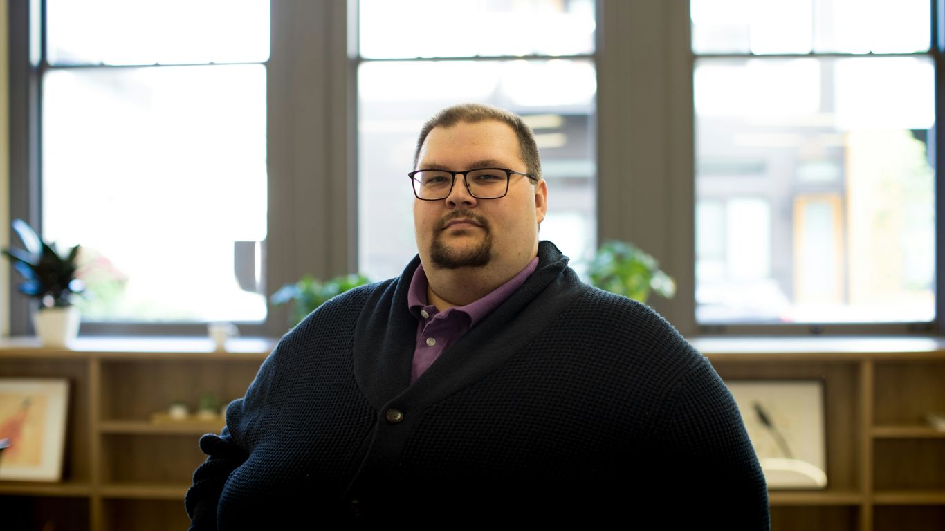 man in black cardigan