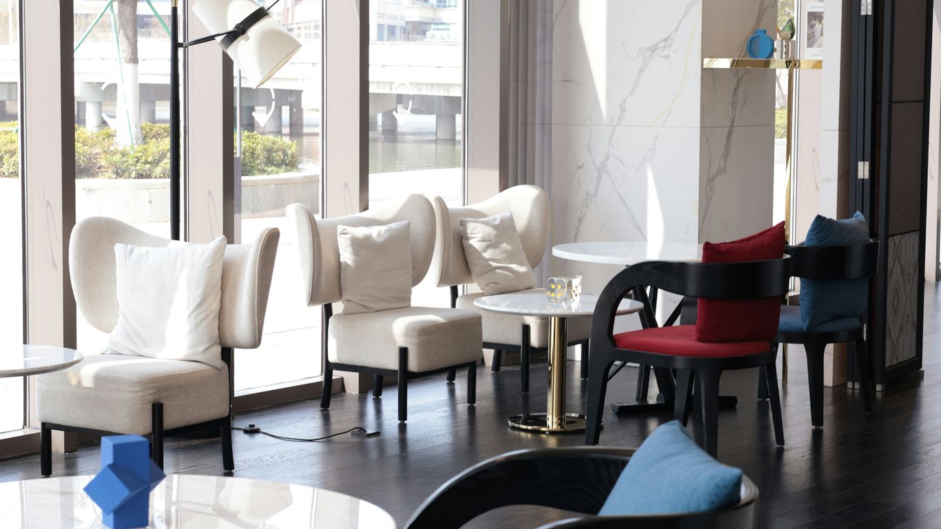 Round marble table beside sofa