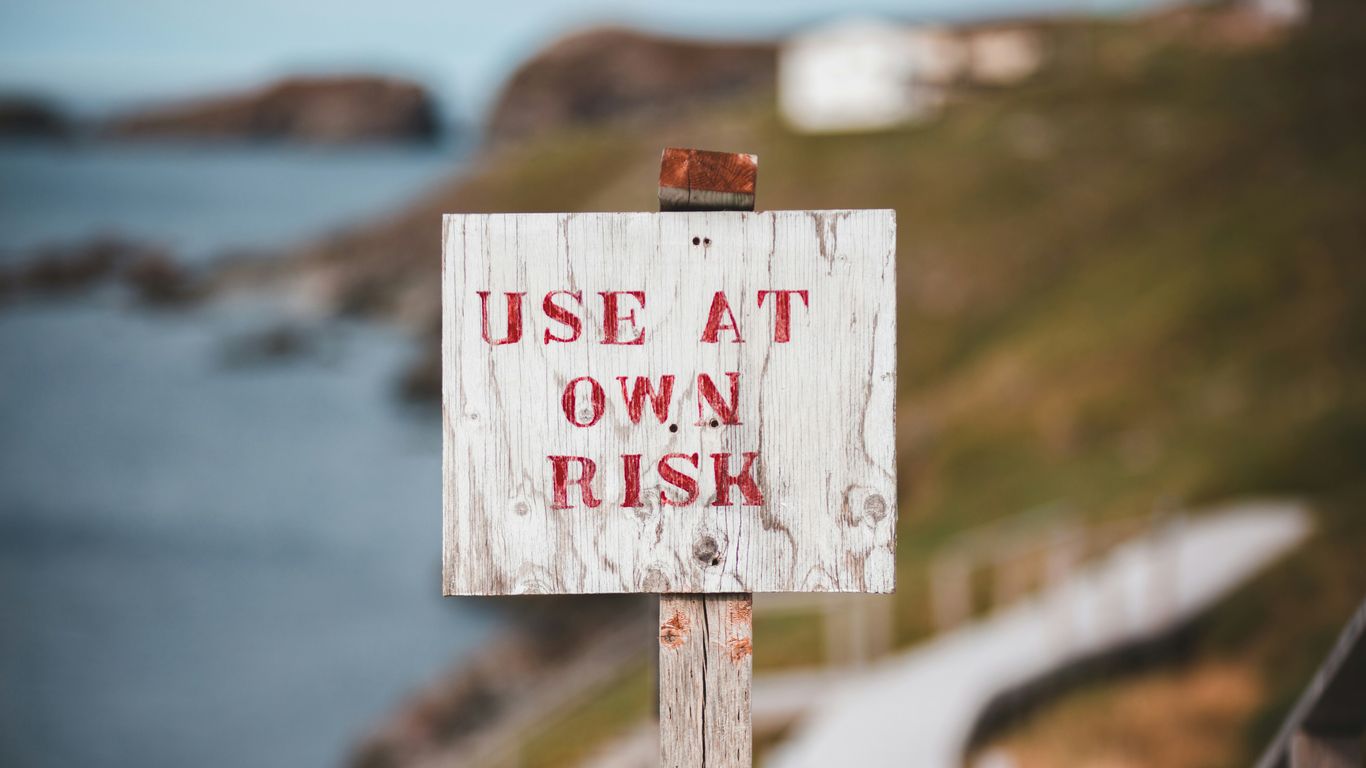 white and red wooden no smoking sign