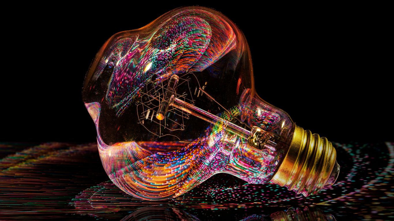 Abstract colorful light trails inside a light bulb