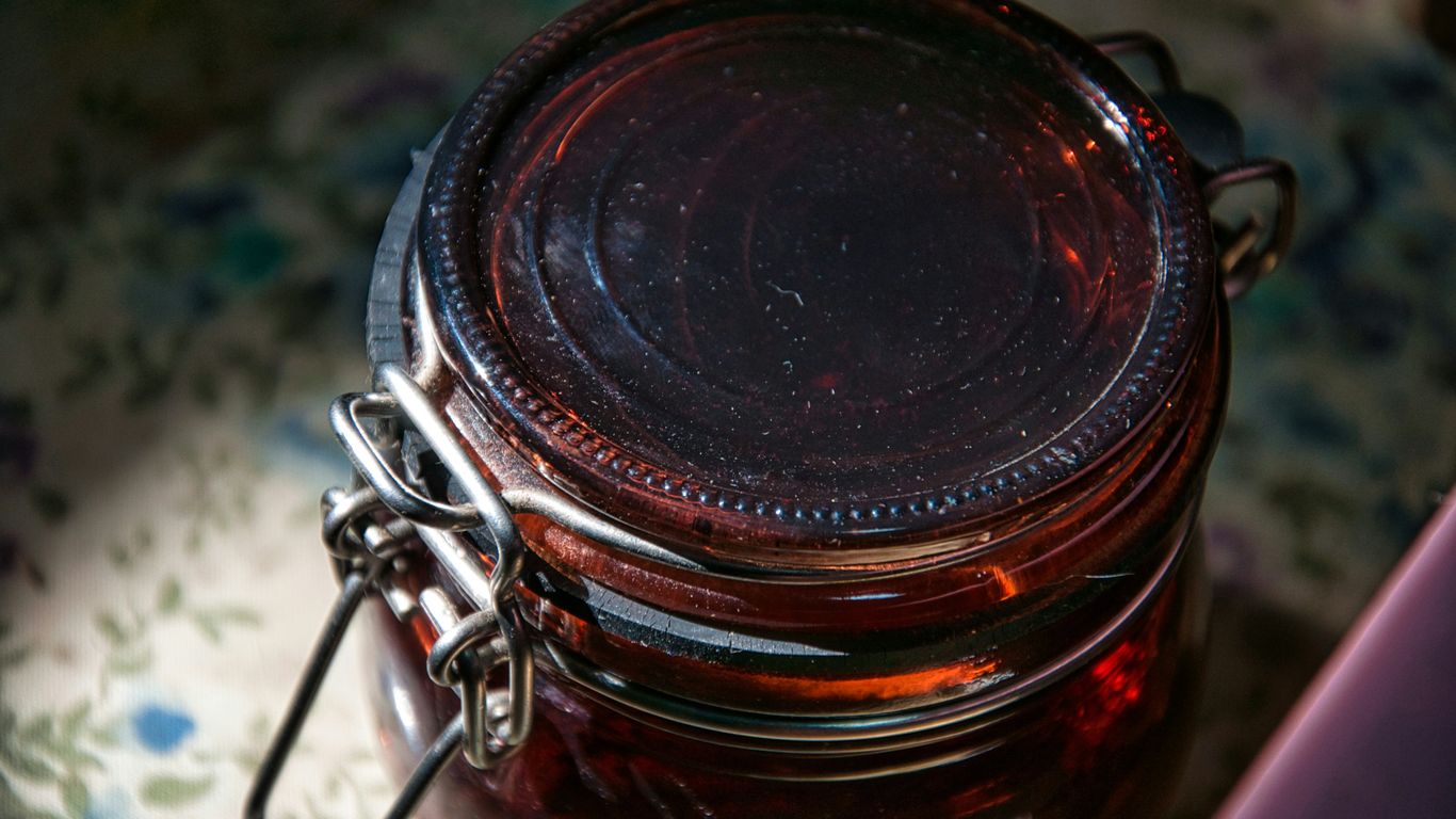 a jar of jam sitting on top of a table