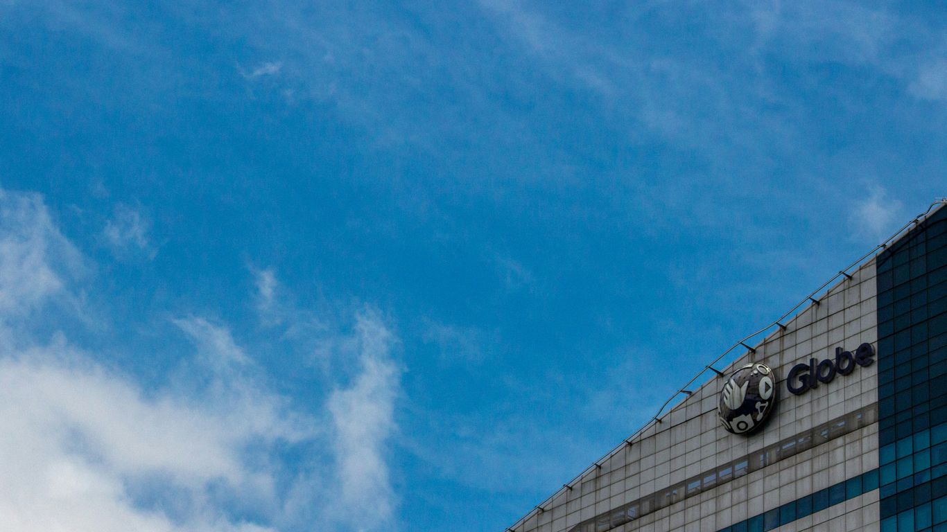 blue and white sky over gray building