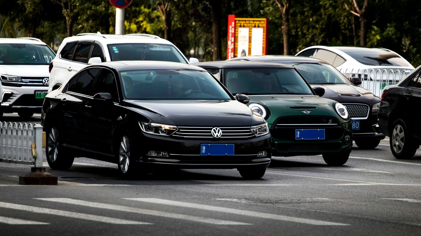 a group of cars parked in a parking lot