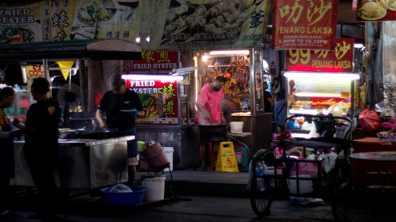 A bustling hawker market scene during the day