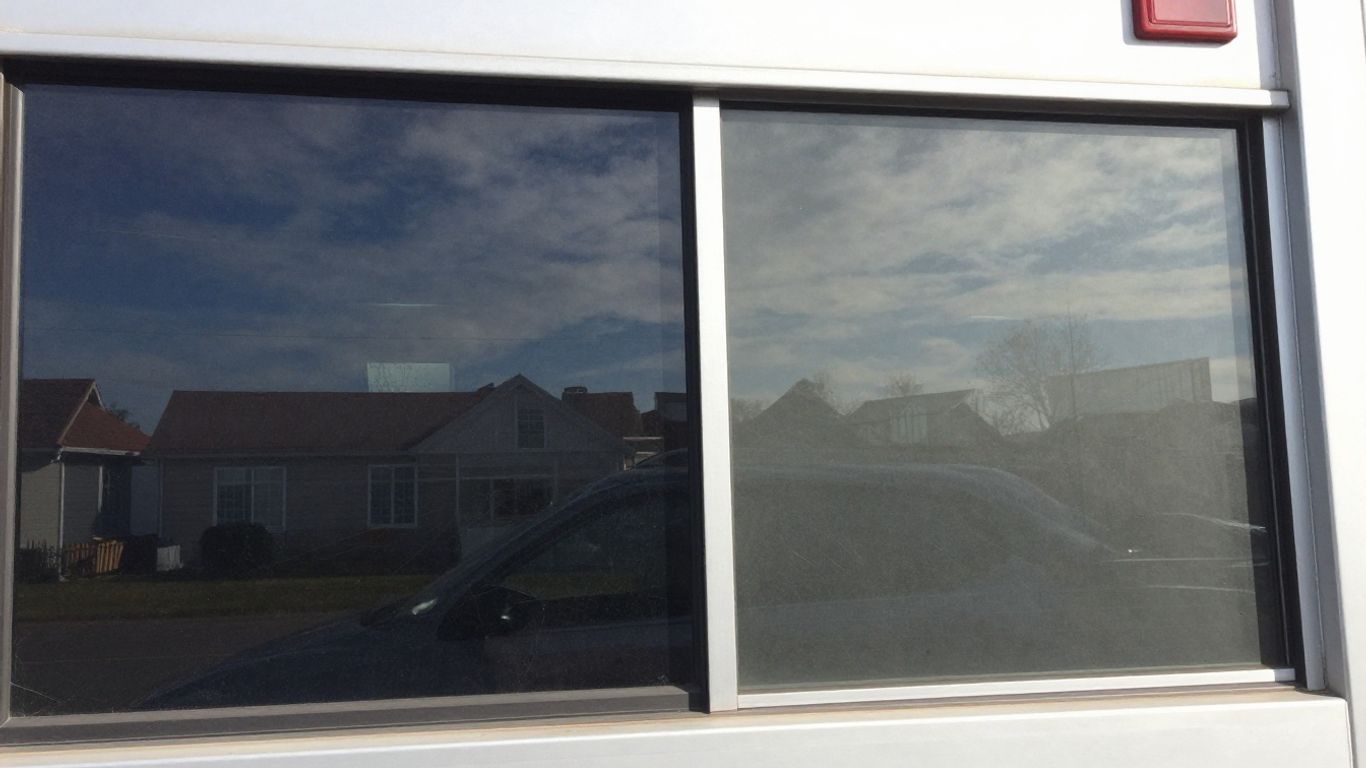 Car, house, and commercial building windows with different tint levels.