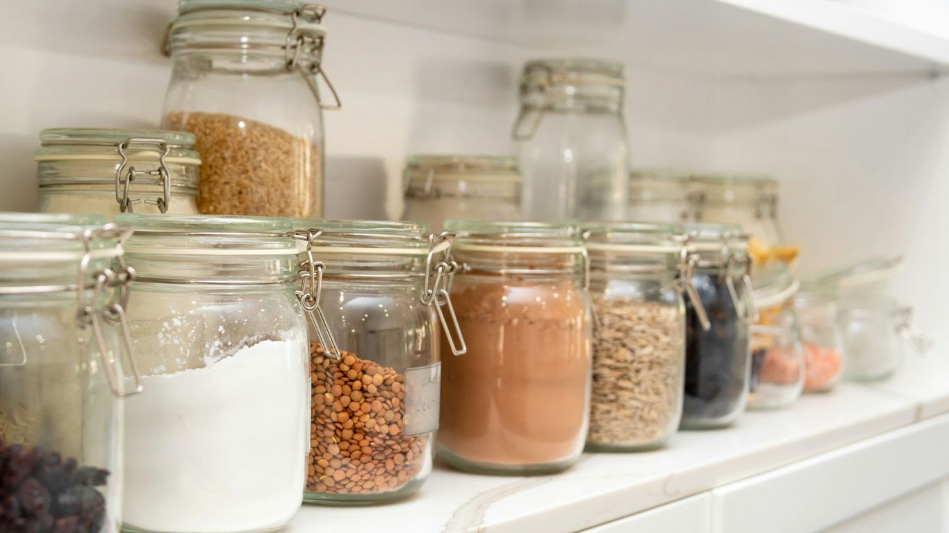 a row of jars filled with different types of food