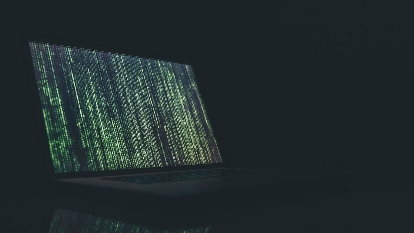 black and gray laptop computer turned on