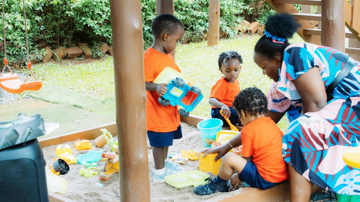 Children washing hands together at preschool