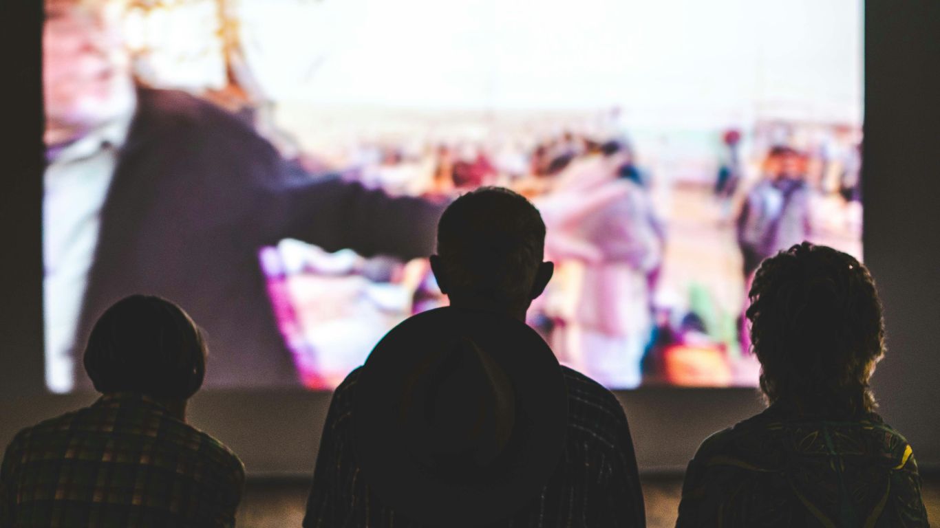 Business owners reviewing a video together