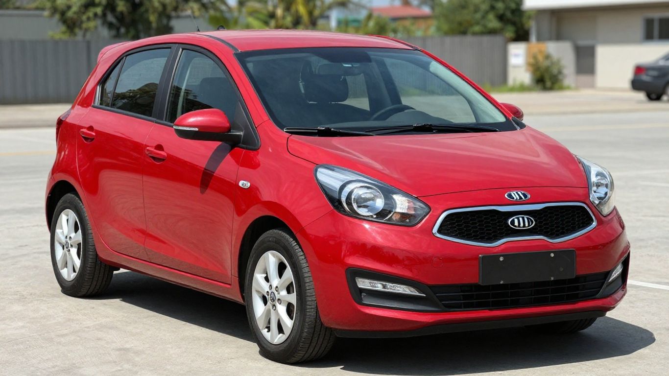 Red Kia Picanto car at a wrecking yard