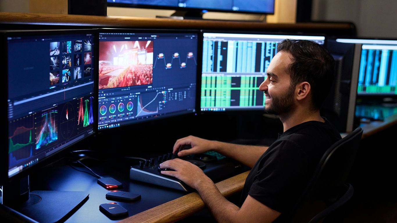 A close-up of a producer reviewing video timelines