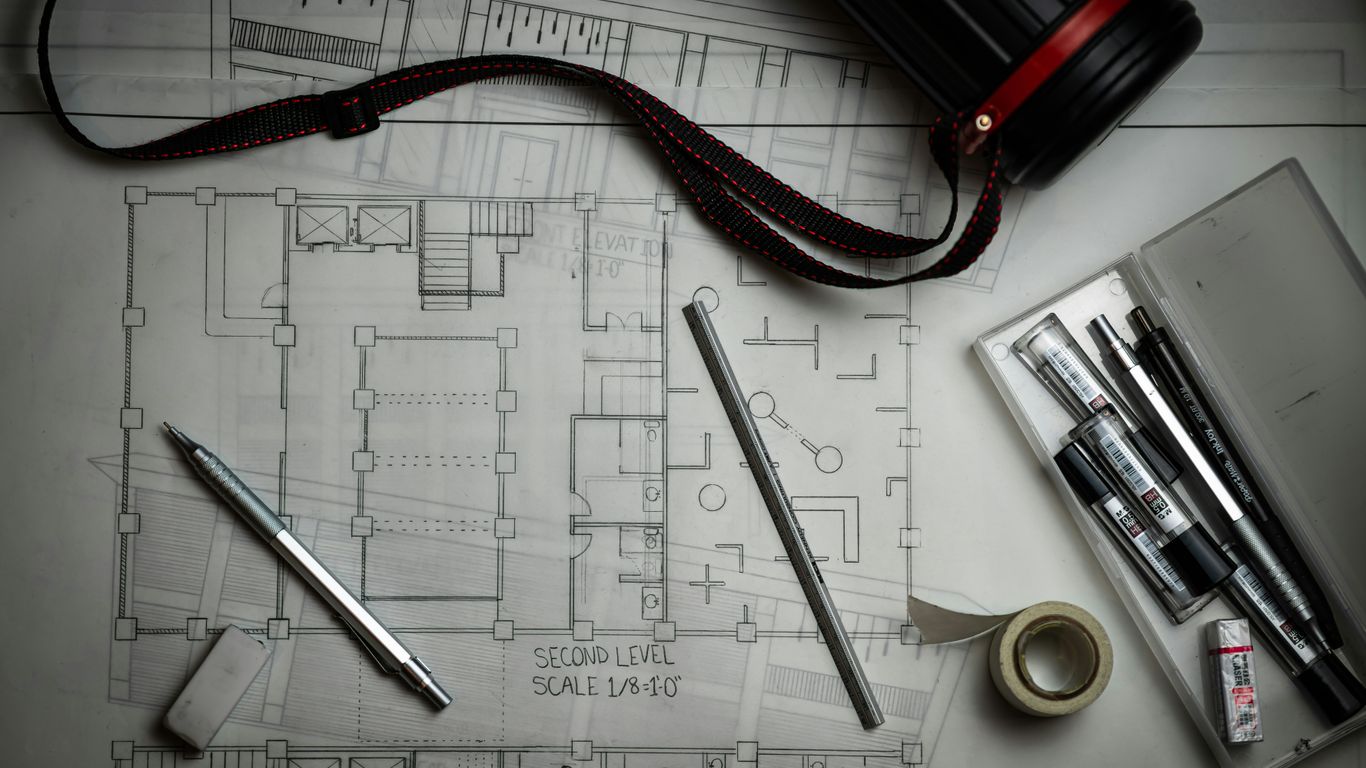 Lighting prototype beside technical drawings
