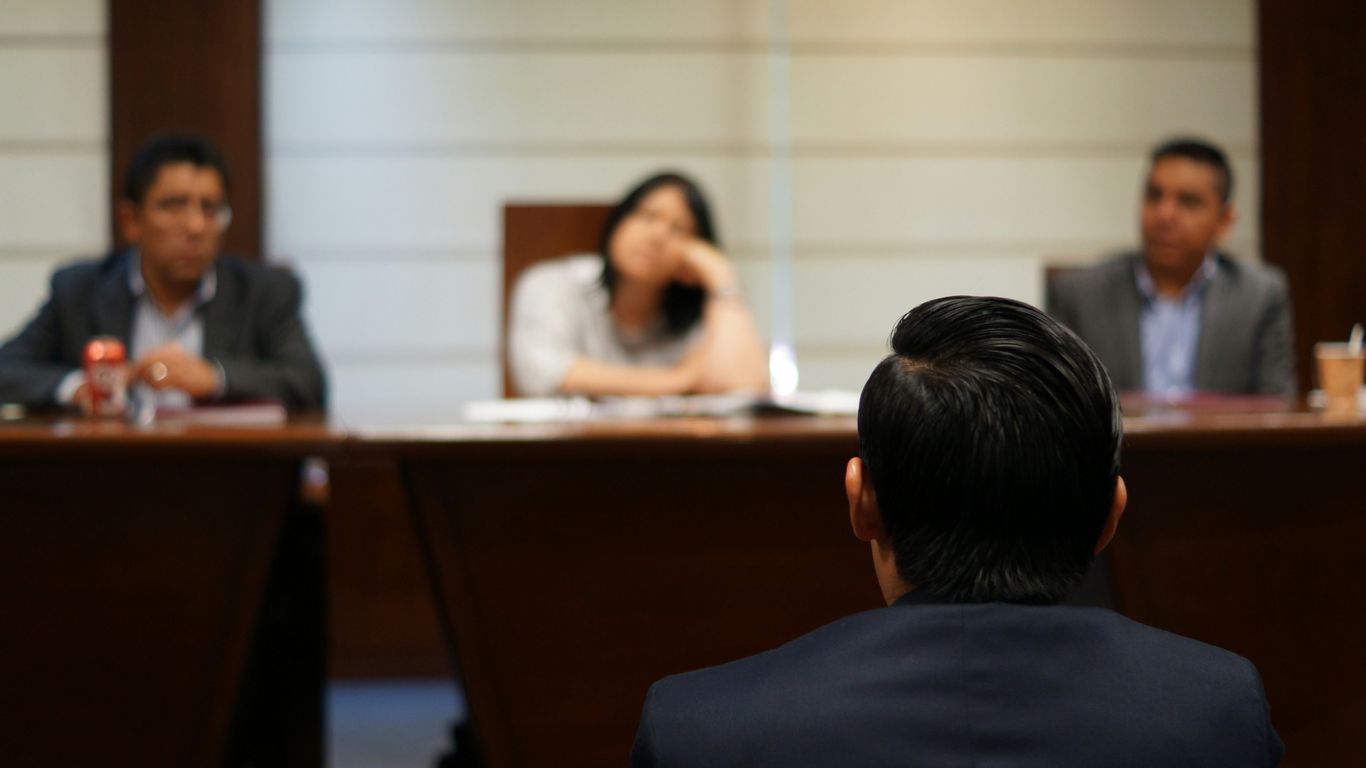 man in black shirt sitting beside woman in white shirt