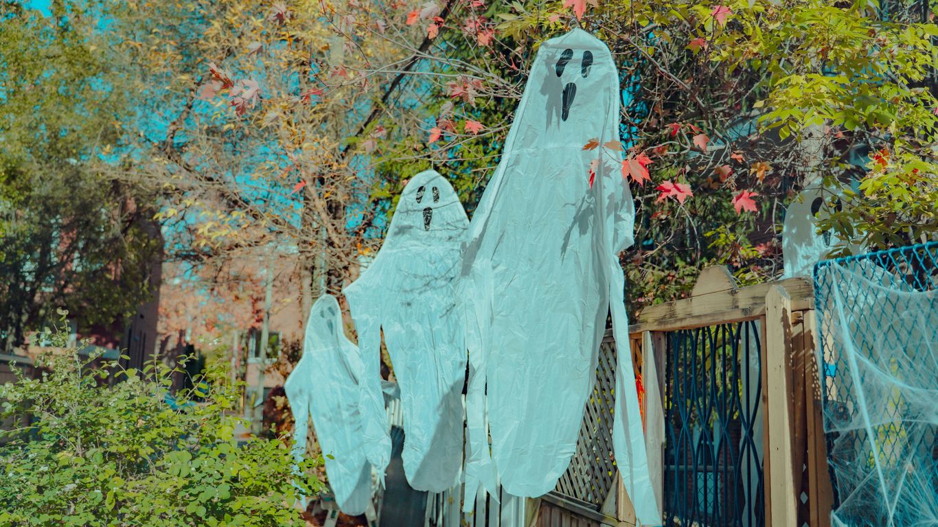 Hanging ghost decorations for halloween outdoors.