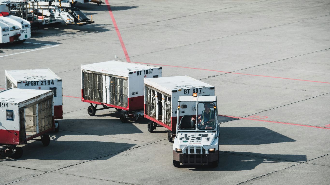 Cargo containers and aircraft at logistics hub