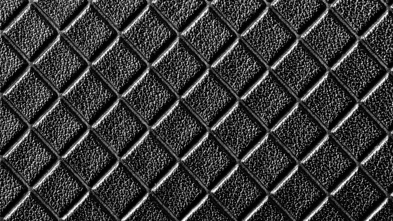 a black and white photo of a textured surface