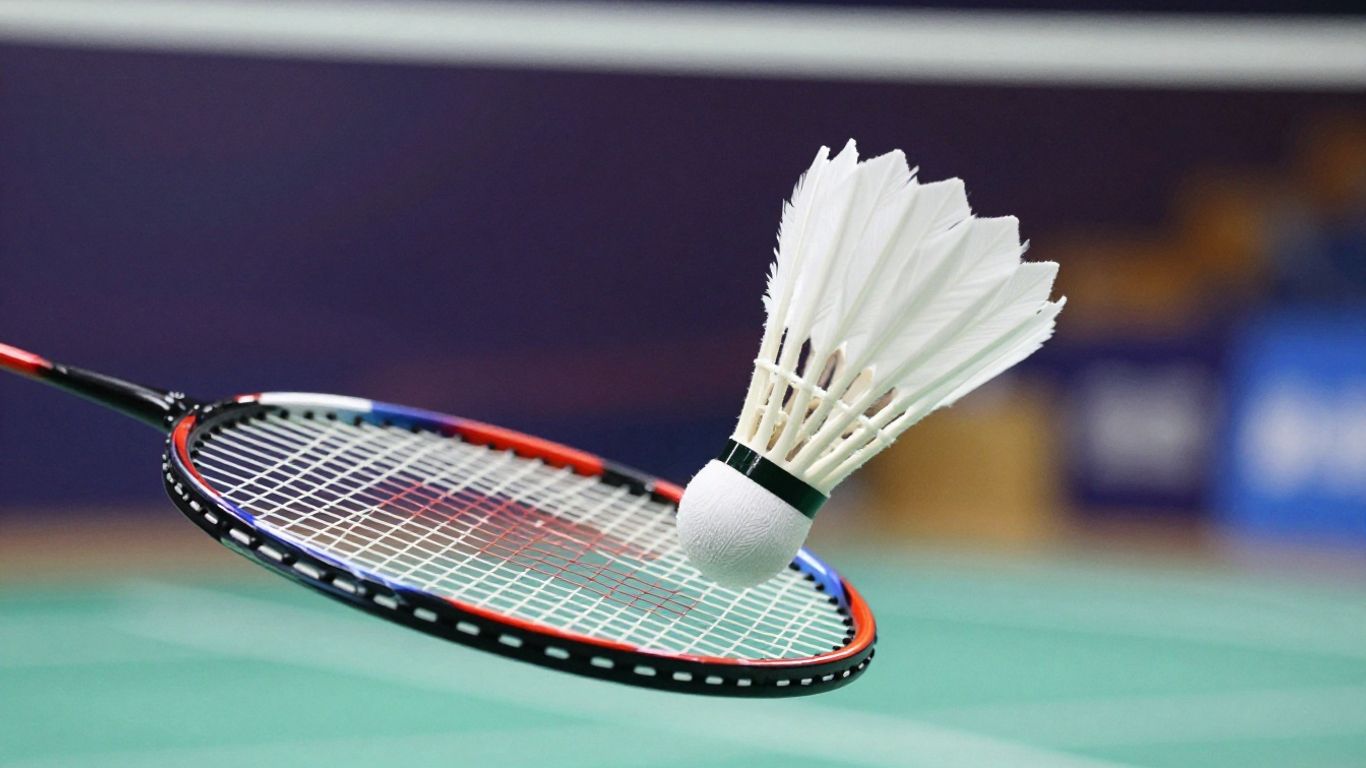 Badminton shuttlecock and racket in action.