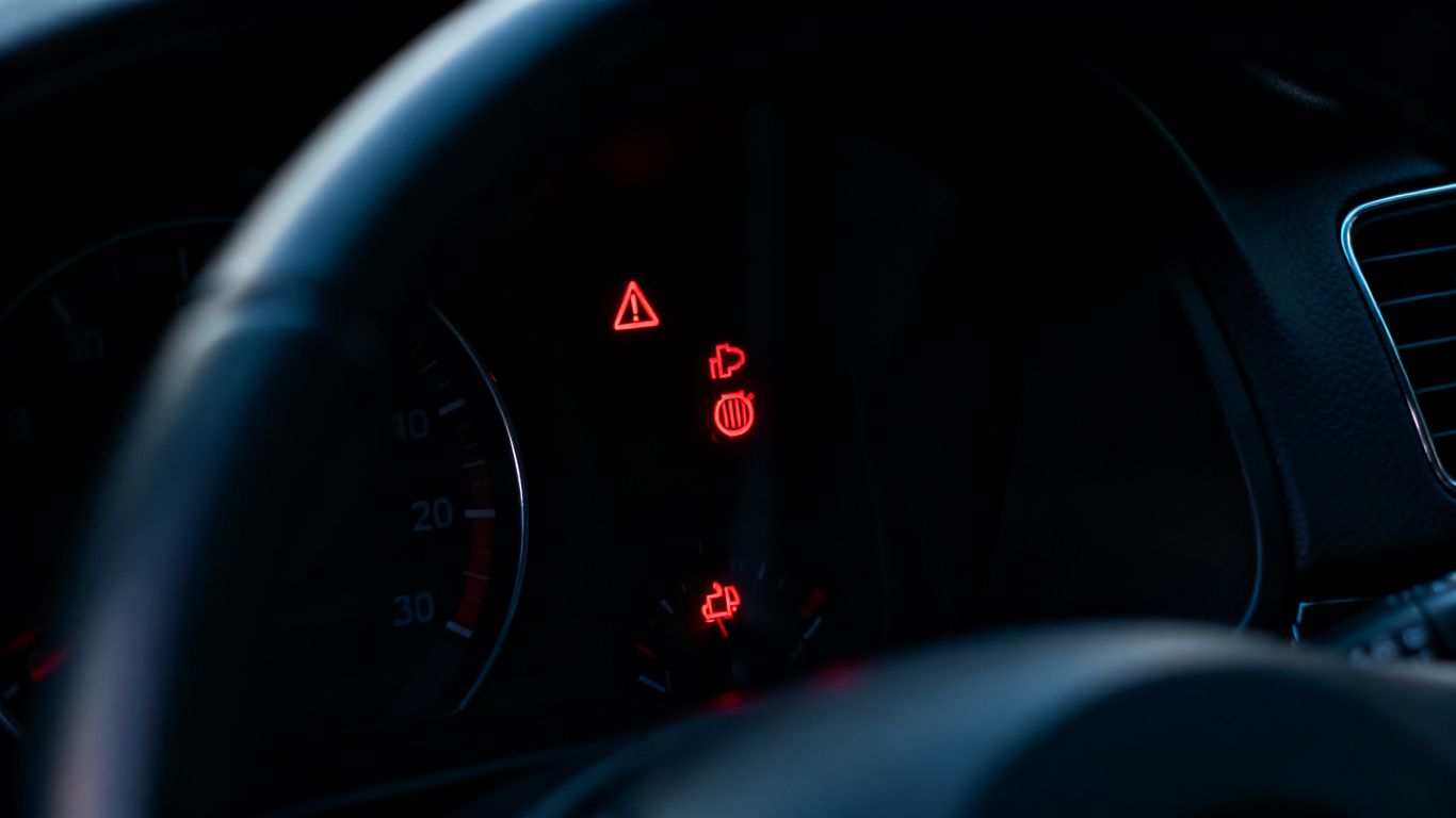 Photograph of illuminated BMW dashboard symbols