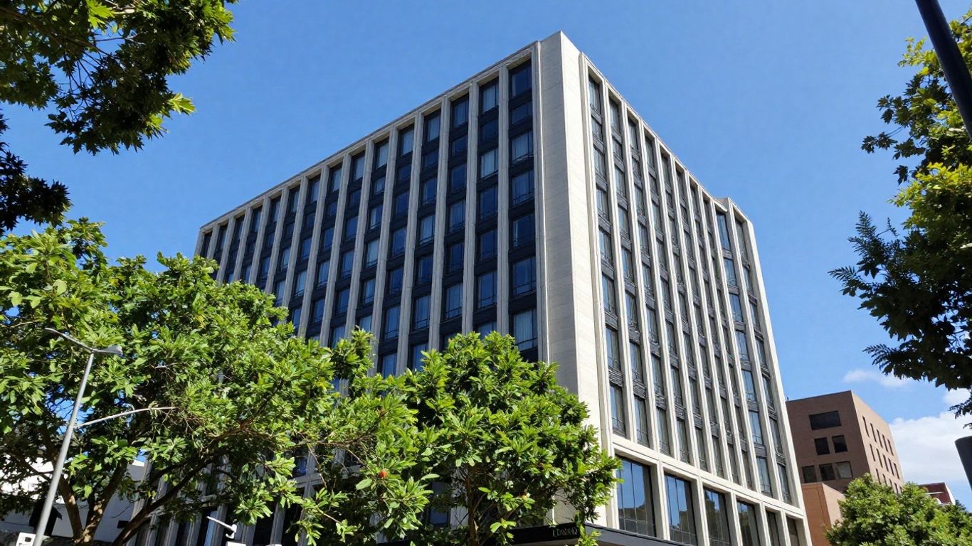 Oaks Melbourne On Market hotel exterior with city backdrop.