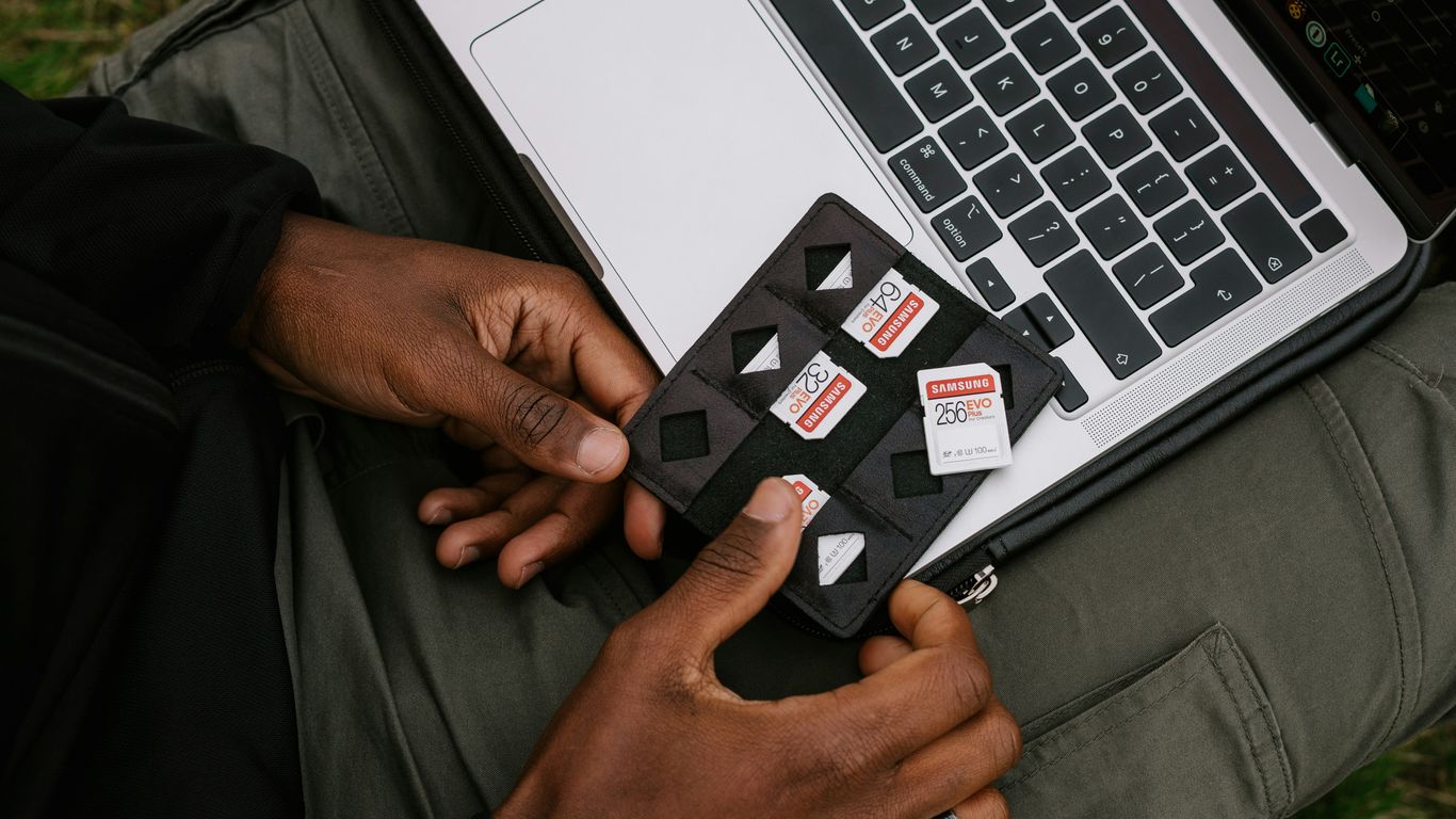 person holding black and white card