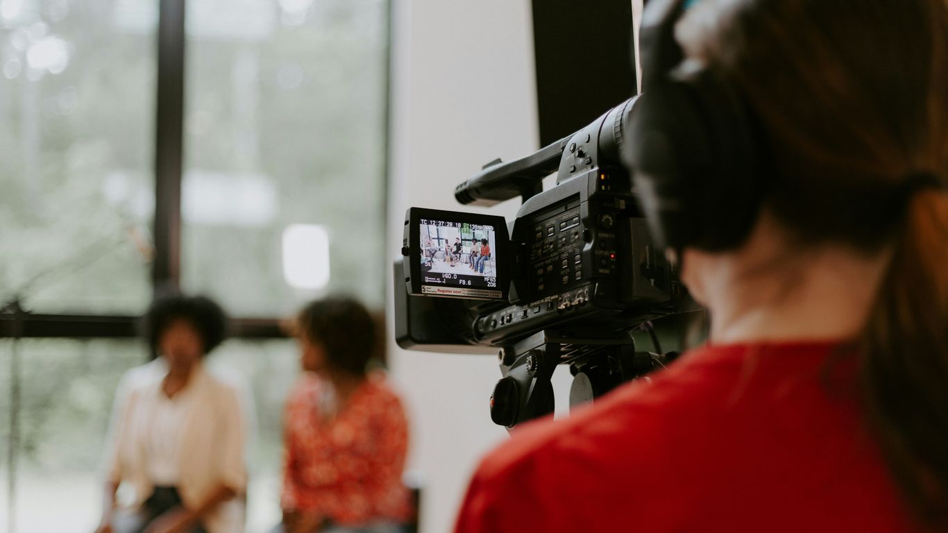 Director of photography coordinating a client testimonial interview