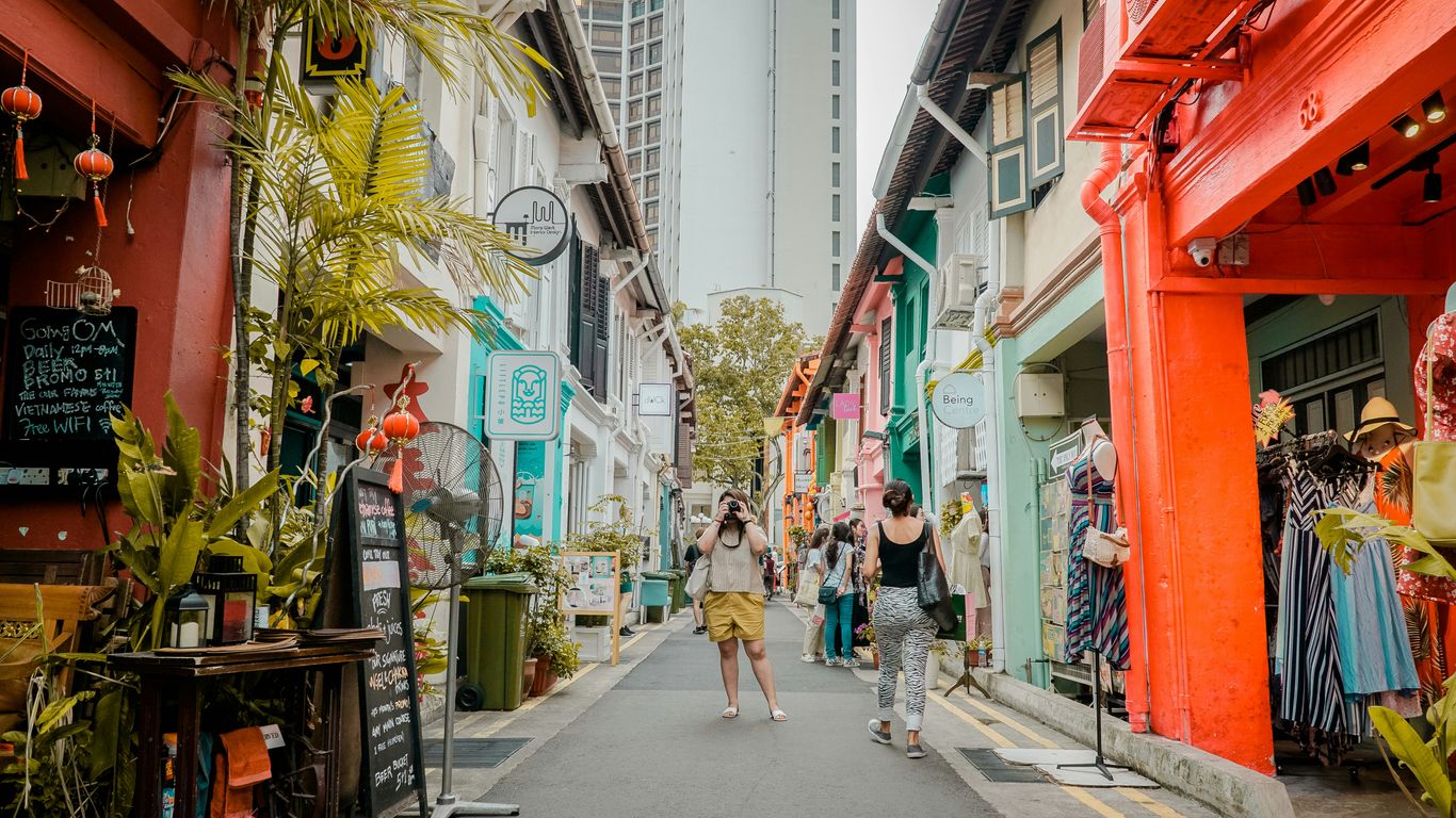 People walking beside Singapore heritage landmarks