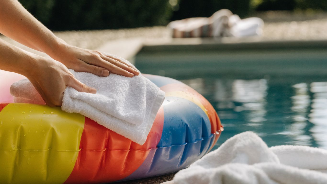 A soft cloth rinsing a fabric pool float