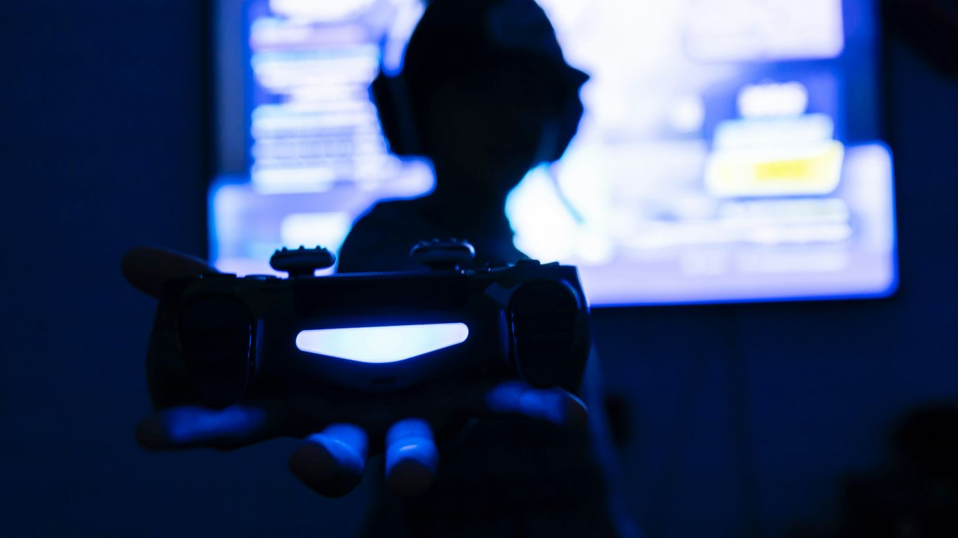 silhouette of man holding camera