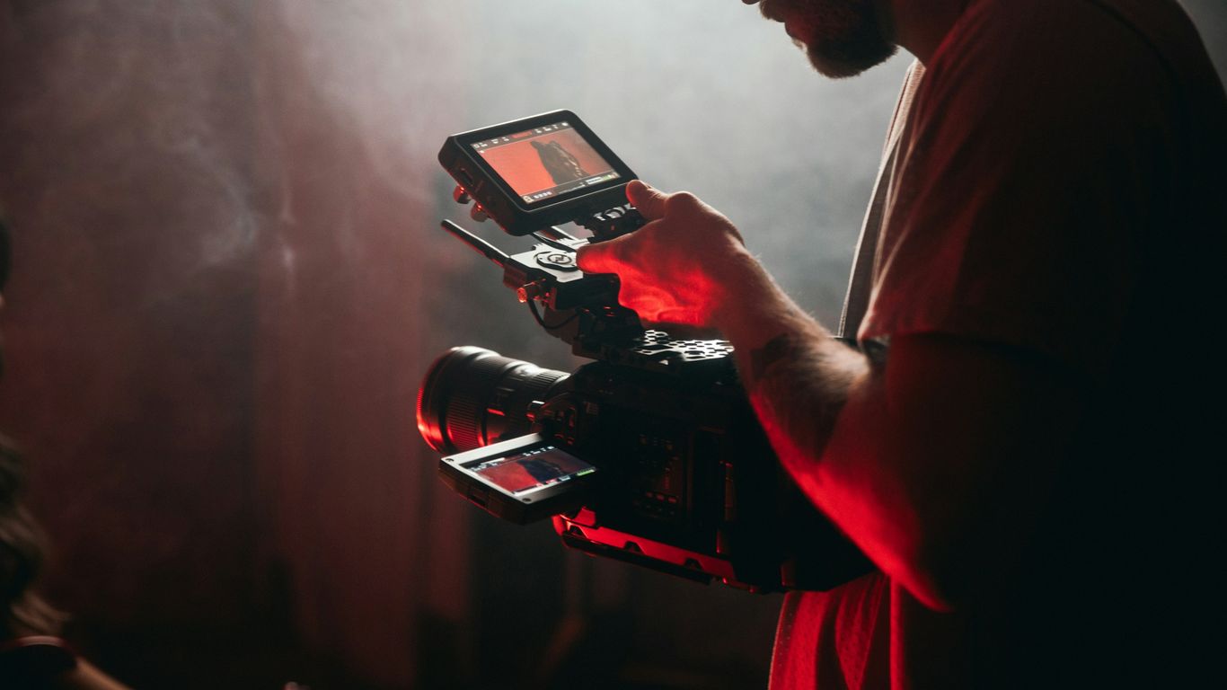 Video creator filming a studio presentation