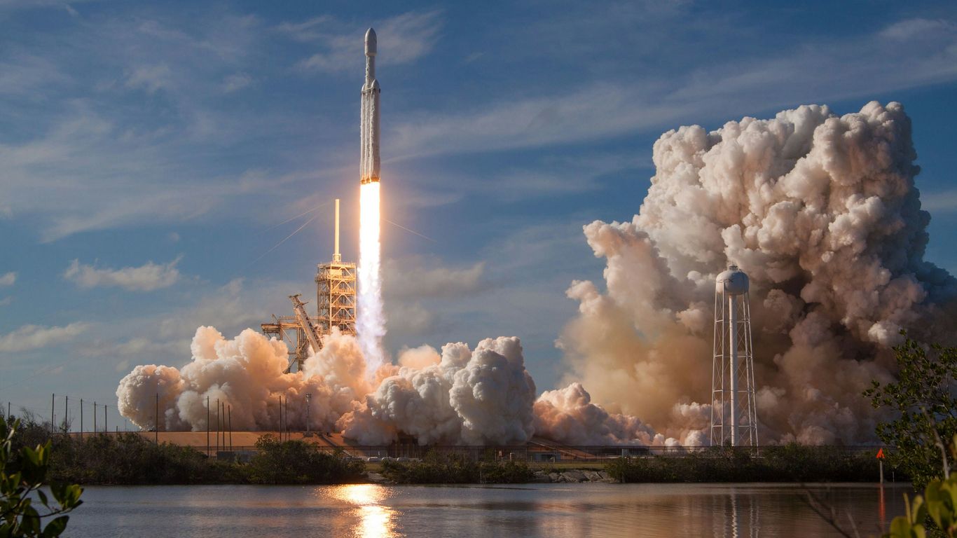 Rocket launching into the dark atmosphere