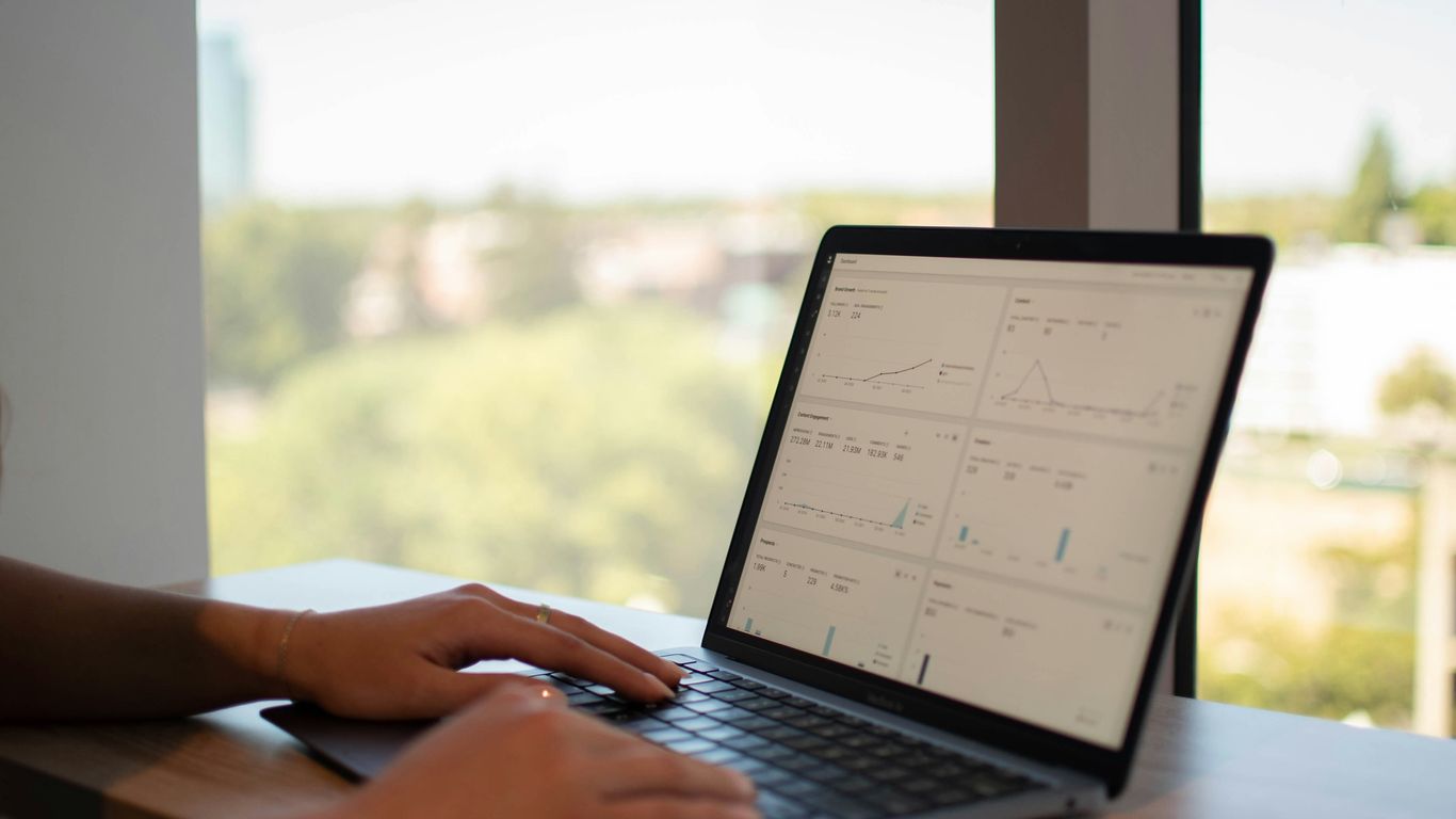 a person typing on a laptop