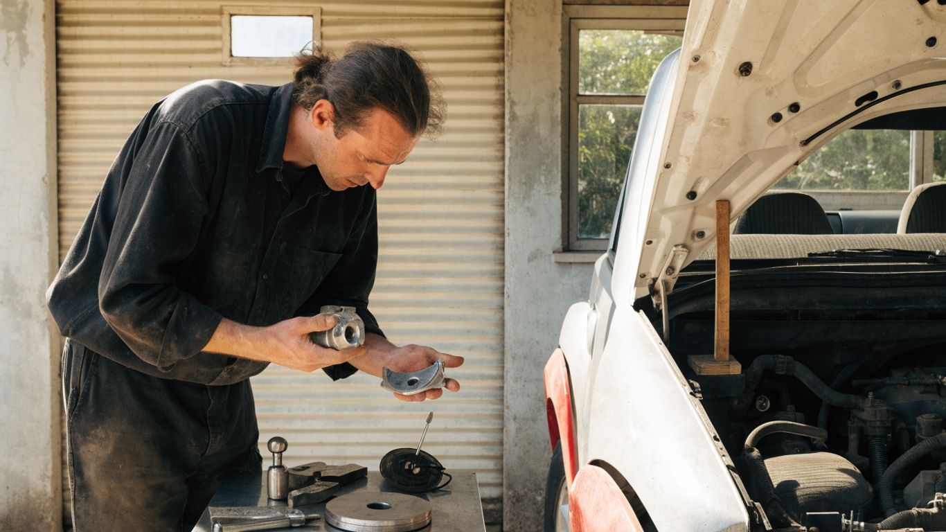 Mechanic checking Skoda part against vehicle details