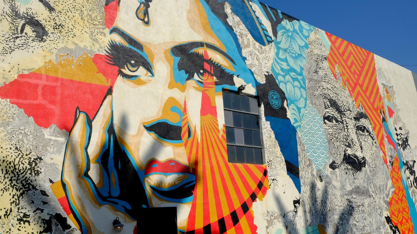 A vibrant mural in an urban alley
