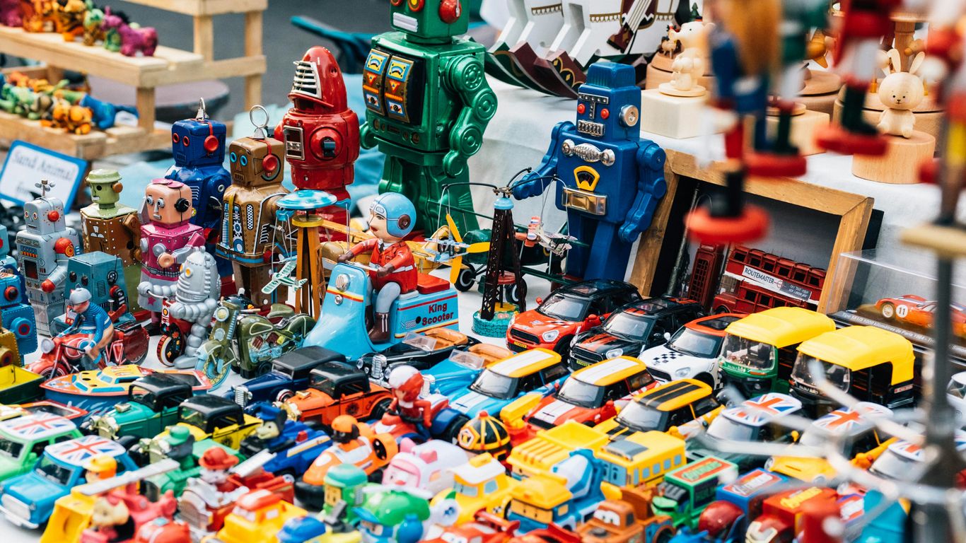 A collection of small vintage toys displayed